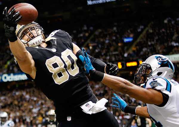 Jimmy Graham (left) is due for a raise, but the Saints are in a deep cap hole.